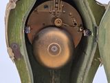 a green clock that is sitting on top of a table