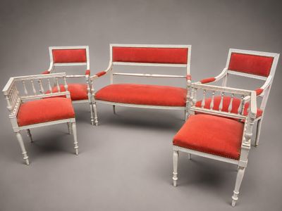 three chairs and a bench with red upholstered cushions