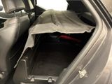 a car with a blanket in the back of it ' s trunk