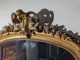 a mirror that is sitting on the wall in the room
