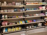 many shelves with various products on them in a store