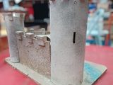 a model of a castle sitting on a red table