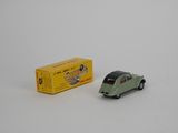 a small toy car next to a box of cigarettes