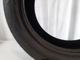 a close up of a tire on a white surface