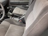 a yellow car with black seats and a steering wheel
