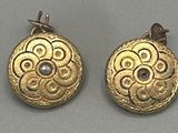pair of gold and diamond earrings