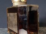 an image of a close up of a bottle of perfume