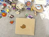 a lot of pins and magnets on the floor