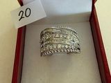 an open box with a ring inside of it on a table