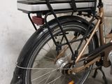a bike that is parked next to a wall