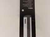 a box with a black and white image of a knife in it