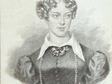 portrait of a woman in a black dress with a chain around her neck