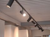 three lights that are on the ceiling in the room