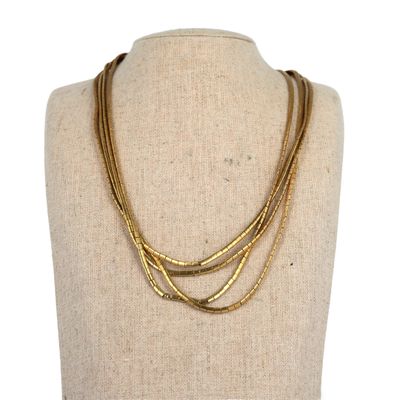 a close up of a mannequin with a necklace on it