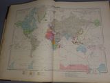 an open book with a map of the world on it