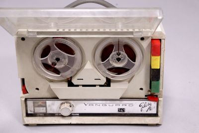 two reels that are sitting on top of a tape recorder
