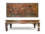 a wooden bench sitting next to a painting on the wall