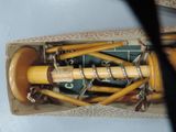 a box with a bunch of wooden items inside of it