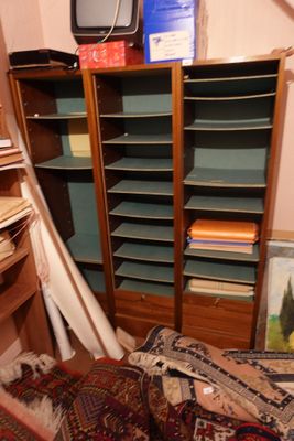a room with a lot of books on the shelves