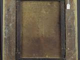 an old wooden easel with a painting hanging on it ' s side