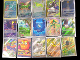 a lot of pokemon cards on a black background
