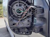 a close up of a car ' s door handle with wires attached to it