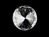 a close up of a white diamond on a black background