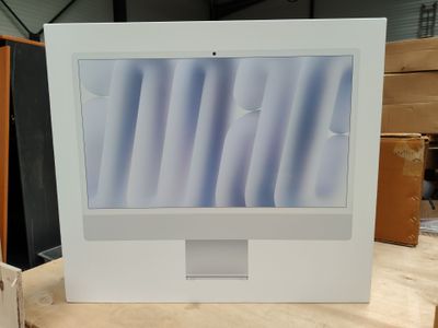 a picture of a computer monitor sitting on top of a wooden table