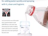 someone is pouring water from a bottle into a water dispenser