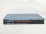 three books stacked on top of each other on a table