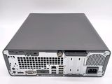 the back view of a computer with a hard drive on top of it