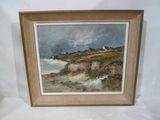 framed oil painting of a beach scene with a lighthouse in the distance