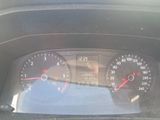 a close up of a car dashboard with a speedometer and gauges
