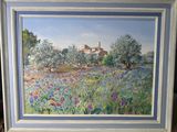 une peinture à l'huile représentant un champ de fleurs sauvages avec une église en arrière-plan