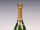 an image of a bottle of champagne sitting on a table