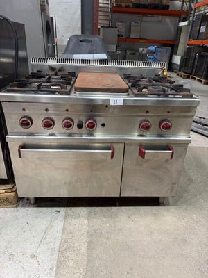 a large stainless steel stove with two ovens on it