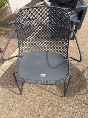 a chair that has a grill on top of it