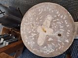 a large piece of bread sitting on a table next to a piano
