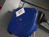 a blue hose attached to a wall with a number 77 on it