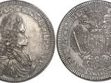 a close up of two silver coins on a white background