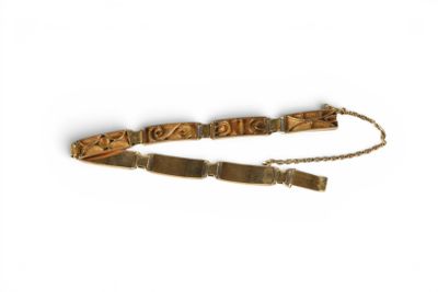 a wooden bracelet with a metal clasp on a chain