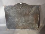 a metal sign that is hanging on a wall
