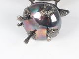 silver plated necklace with a black and purple glass bead