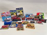 a lot of toy cars that are sitting on a table
