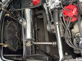 a close up of a car ' s engine with the hood open