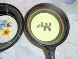 two pans that are sitting on a table