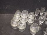 a lot of empty wine glasses sitting on a table