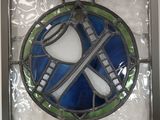 a stained glass window with a blue and green design on it