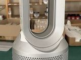 an image of a room heater sitting on top of a green table