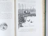 an open book with a picture of a man in a boat